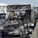 Chiếc xe buýt bị cháy trơ khung trong khủng hoảng con tin ở Italy ngày 20/3. Ảnh: AFP.