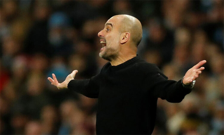 Guardiola đầu hàng ngay sau giai đoạn lượt đi. Ảnh: Reuters
