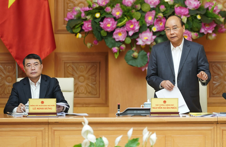 Thủ tướng Nguyễn Xuân Phúc chủ trì cuộc họp Hội đồng tư vấn chính sách tài chính, tiền tệ ngày 25/2. Ảnh: VGP