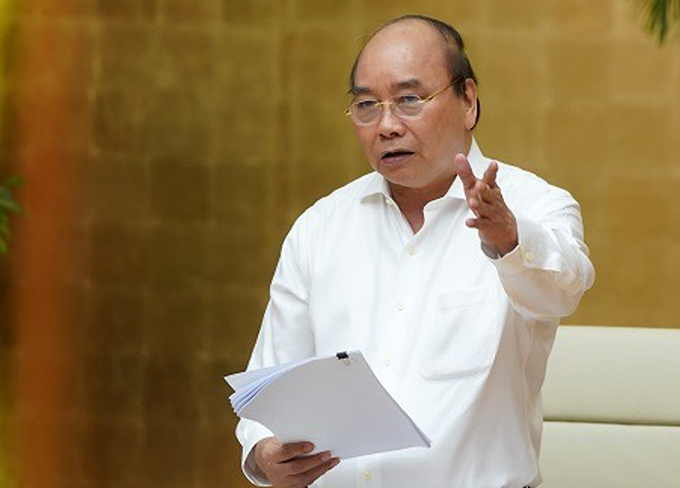 Thủ tướng Nguyễn Xuân Phúc làm việc trực tuyến với lãnh đạo chủ chốt của TPHCM hôm nay. Ảnh: VGP/Quang Hiếu